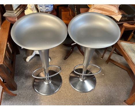Two adjustable chrome and silver bar stools, 78cm h at full height, designed by Stefano Giovannoni.Condition ReportLight surf