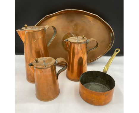 Various copper ware to include a twin handled tray 47cm, 3 graduating lidded jugs tallest 26cm h and a copper pan with brass 