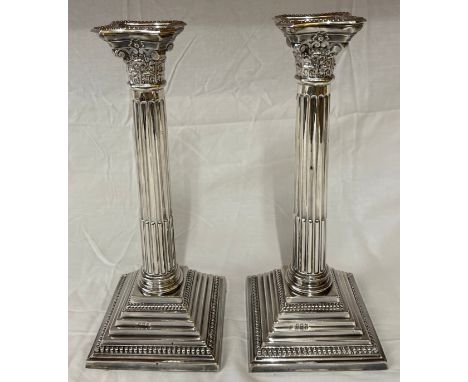 A pair of silver Corinthian column stepped candlestick holders, Birmingham 1956 AS 30.5cms h. 2103 gramsCondition ReportSligh