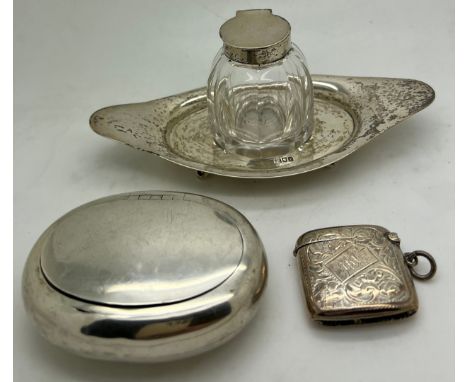 A silver and glass inkwell on stand London 1901, a snuff box Birmingham 1920 maker Robert Chandler and  a vesta case with fol