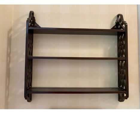 A mahogany wall shelf with fretted sides. Marked R. Armstrong to base.Condition ReportGood condition.