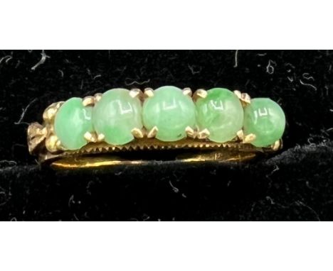 A 22 carat gold ring set with jade, size L, 3.6gm.