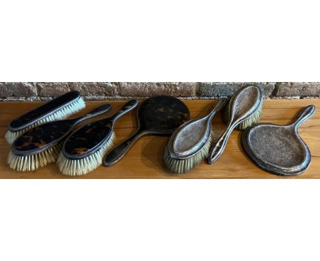 Two part dressing table sets, one silver backed mirror and 2 hairbrushes Birmingham 1910, the other tortoiseshell and silver 
