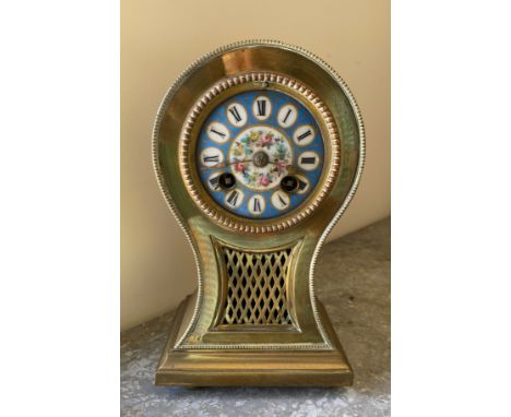 Brass mantle clock with enamelled face, roman numerals and chiming bell.Condition ReportUntested, lacking key and glass cover