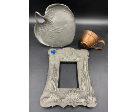Pewter picture frame set with a blue cabochon to top left,  depicting a bird flying over bulrushes and water lilies, 31cm h x