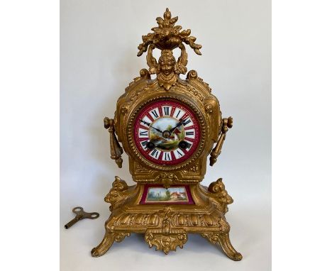 An ornate french mantle clock with pictured with Roman numerals high striking on a bell 8cm dial, 30cm tall. 