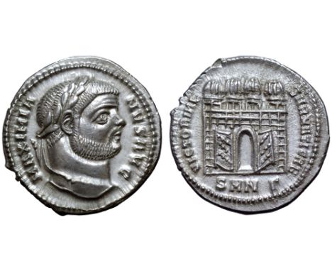 Maximian AR Argenteus. Nicomedia, AD 295. MAXIMIANVS AVG, laureate head right / VICTORIAE SARMATICAE, camp gate with four tur