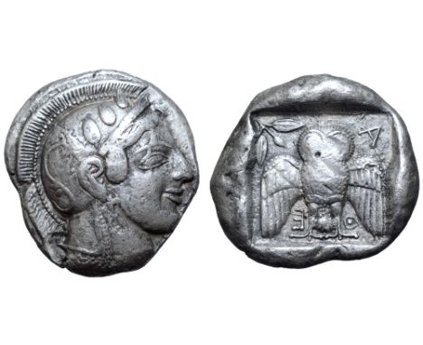 Attica, Athens AR Dekadrachm. Circa 469/5-460 BC. Head of Athena right, wearing single-pendant earring, necklace, and crested