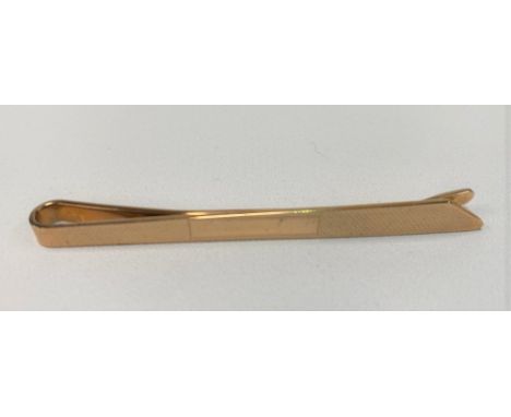 A 1960's 9ct hallmarked gold engine turned tie clip, length 68mm, Birmingham 1961, weight 6.7g approx