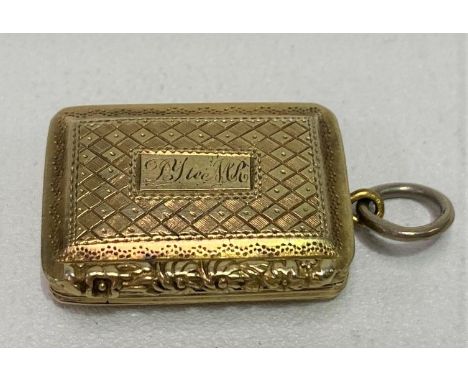 A George IV silver gilt engine turned vinaigrette fob, the hinged lid with engraved name and with foliate cast edge, hinged t