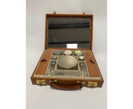 Good George VI gentlemans vanity travel case by Asprey, London, the ostrich leather hinged case with gilt tooled initials A.M