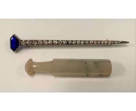A celadon green jade cheroot holder, length 57mm; together with a paste set Art Deco brooch, length 9cm (2).