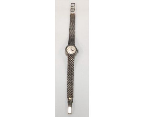 Omega 9ct white gold ladies manual wind bracelet wristwatch with 13mm silvered dial with silver baton markers, the seventeen 