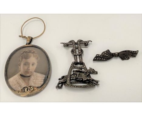 Victorian oval portrait miniature on ivory depicting a  young woman, the gold plated frame dated 1875, height including suspe