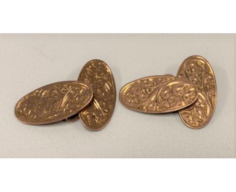 A pair of 9ct rose gold oval cufflinks, with foliate scroll engraved decoration, weight 6.2g approx. 