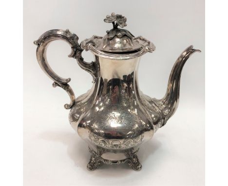 A silver plated foliate scroll engraved tea pot by Elkington &amp; Co, of baluster form with foliate cast lid finial, the bod