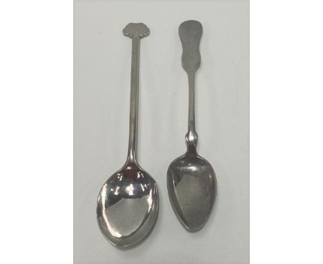 A Chinese white metal spoon with long handle and flattened finial, character marks to the back, length 17cm; together with a 