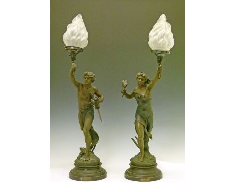 Pair of 19th Century French bronzed spelter figural table lamps depicting classical male and female figures, each holding a f