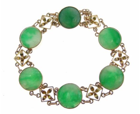 Jade bracelet, stamped '15ct', the six circular jade panels with cruciform motifs between, to a hidden box clasp, 17.5cm long