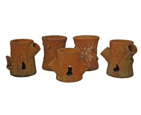 Set of three early 20th Century terracotta strawberry planters, each modelled as a trunk stump, 30cm and 37.5cm high together