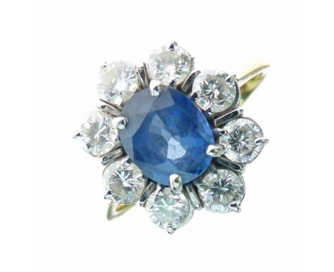 Sapphire and diamond 18ct gold cluster ring, the oval cut sapphire 8mm x 7,2mm x 4mm deep, enclosed by eight brilliant cuts t