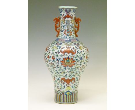 Chinese porcelain baluster shaped two handled vase having allover polychrome foliate scroll work and stylised bats, gilt high