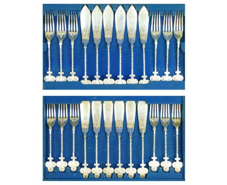Twelve person set of engraved silver plated fish knives and forks, each piece having a spiral twist handle with a trefoil fin