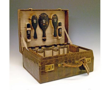 Early 20th Century lady's crocodile leather toiletry case containing tortoiseshell and tortoiseshell mounted requisites compr