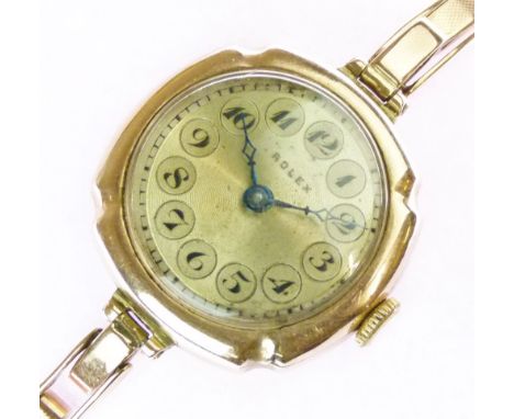 Rolex - Lady's 9ct gold circular cased wristwatch, the signed silvered dial with blued steel hands, Arabic numerals within ci