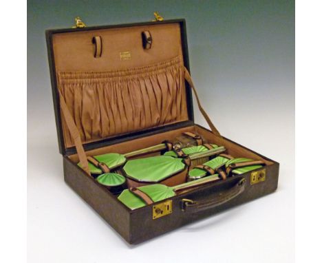 George V silver and green enamel dressing table set, the brushes and mirror by Albert Carter, Birmingham 1941, the jars also 