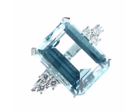 Aquamarine and diamond 18ct white gold ring, the step cut aquamarine measuring 14mm x 11mm x 7.7mm deep, flanked either side 