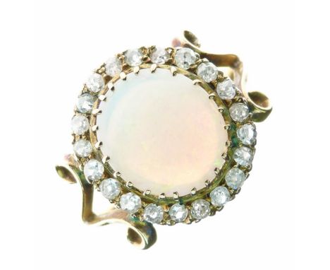 Opal and diamond cluster ring, the shallow cabochon approximately 11mm x 10.4mm, enclosed by twenty-one small old single cut 