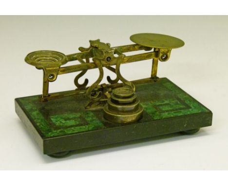 Set of late 19th Century Sampson Mordan brass postage scales with weights, standing on a malachite and black slate rectangula