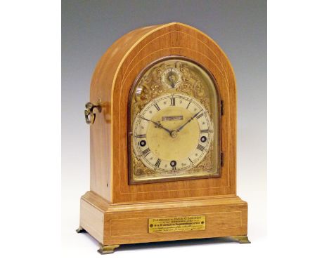 Early 20th Century inlaid mahogany cased mitre shaped bracket clock, the gilt dial with silvered chapter ring having Roman an