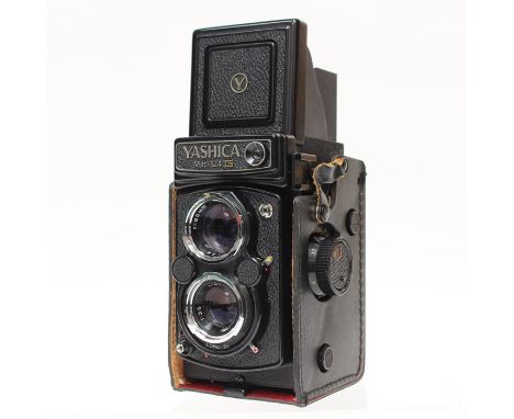 Yashica: A cased Yashica Mat-124G TLR camera, complete with filters and instruction manual.