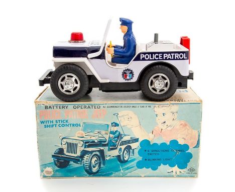 TN Toys: A boxed Japanese, Police Patrol Jeep with Stick Shift Control, battery operated.