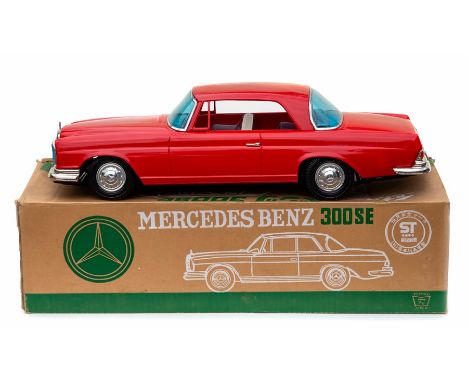 Ichiko: A Japanese, large scale, friction drive tinplate Mercedes Benz 300SE, red body with lithographed interior, boxed.