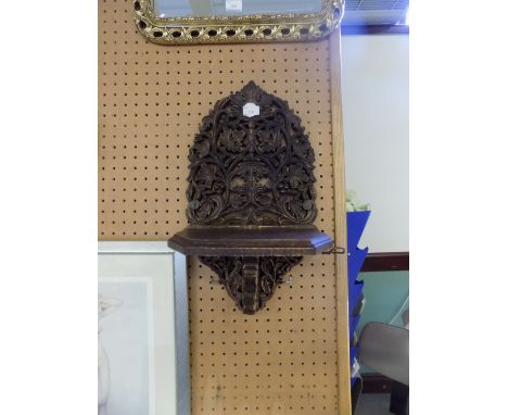 Carved wall bracket
