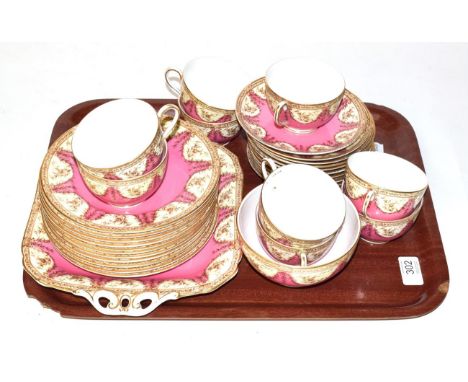 A Royal Worcester pink and gilt part tea service