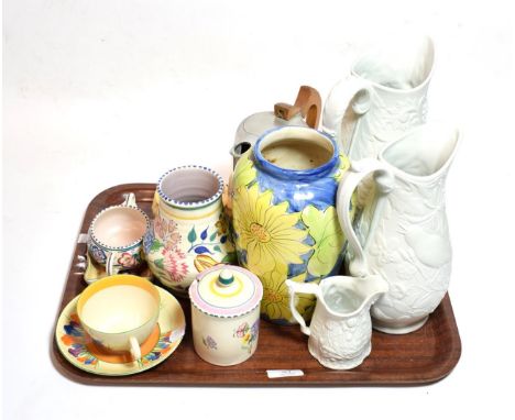 A Clarice Cliff Bizarre ware crocus pattern tea cup and saucer; Portmerion jugs; Poole pottery; Piquot ware teapot etc . Clar
