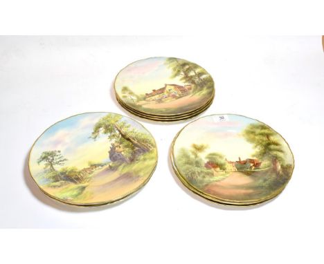 A set of eleven Royal Worcester cabinet plates, each painted and signed, depicting scenes from England, each 27cm diameter, c