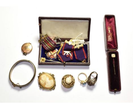 A 9 carat gold stick pin; a silver bangle; two cameo brooches; costume jewellery including a locket and three rings; and a qu