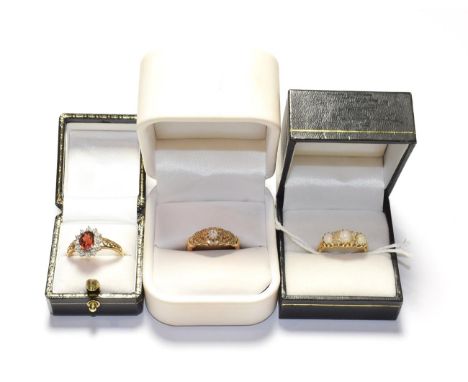 A diamond ring, stamped '18CT', finger size N; an 18 carat gold opal and diamond ring, finger size N; and a 9 carat gold garn