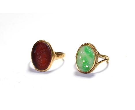 A 9 carat gold jade ring, finger size M; and a cornelain intaglio ring, stamped '9CT', finger size O.  Gross weight 6.3 grams