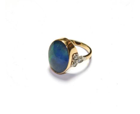 An opal doublet and diamond ring, stamped '9CT', finger size N.  Gross weight 5.5 grams. 