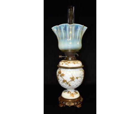 A LATE VICTORIAN OIL LAMP  with frilled vaseline glass shade, Messengers Patent burner, satin glass (?) body with gilt foliat