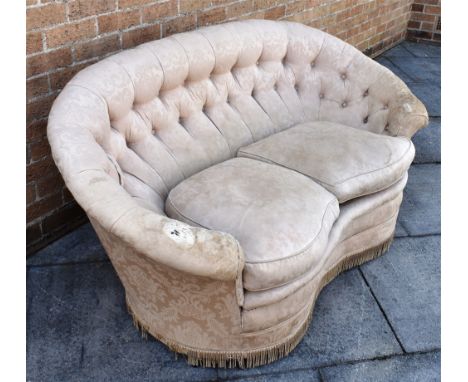 AN UPHOLSTERED BUTTON BACK SERPENTINE TWO-SEAT SOFA  77cm high, 157cm wide, 87cm deep.