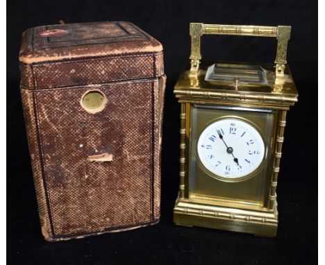 A GILT METAL CASED CARRIAGE CLOCK WITH REPEAT MECHANISM  striking the hours and half hours on a coiled gong, the enamel dial 