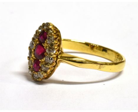 A VICTORIAN RUBY AND DIAMOND CLUSTER RING  the marquise shaped cluster with three rubies to the centre and a surround of four