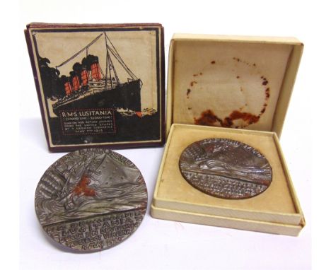 MILITARIA - TWO BRITISH PROPAGANDA ISSUE 'LUSITANIA' (GERMAN) MEDALLIONS  one in original box with pictorial hinged lid; the 